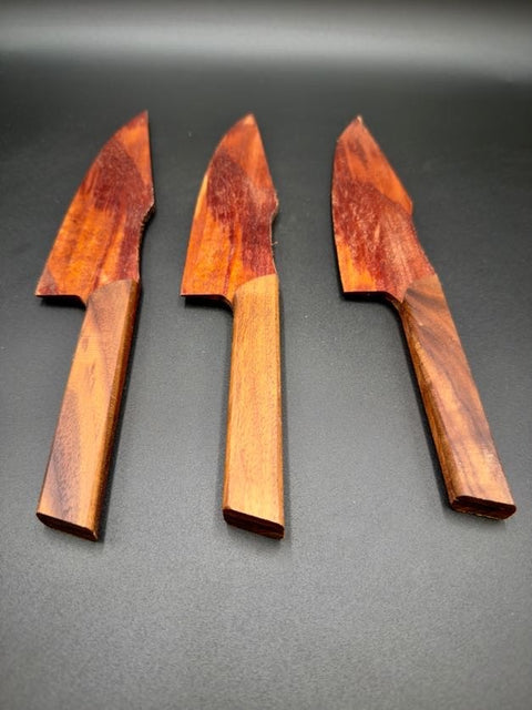Three hardwood cake knives laid flat handmade in San Diego by Mostad Works