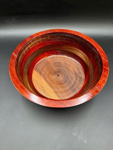 Top view of red and walnut turned wood bowl handcrafted in San Diego by Mostad Works