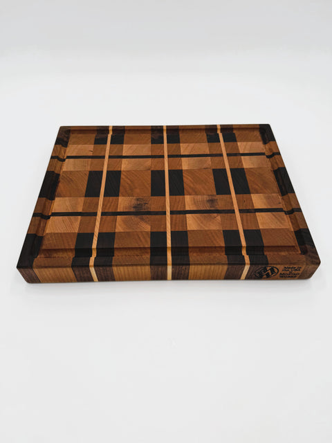 Plaid pattern end-grain cutting board in maple cherry and walnut handcrafted in San Diego