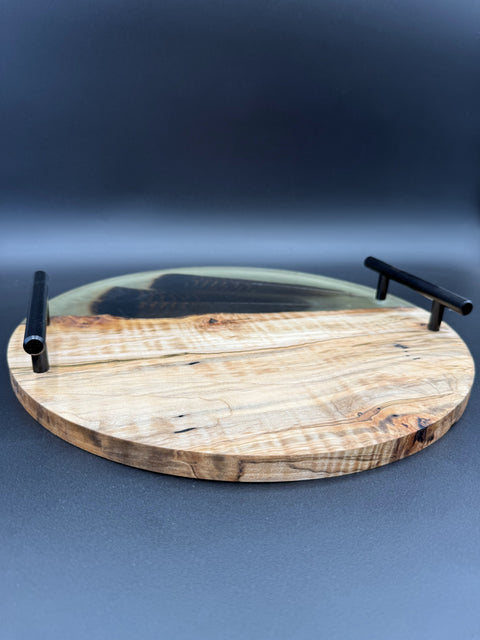 Angled view of round epoxy wood serving tray handmade in San Diego by Mostad Works