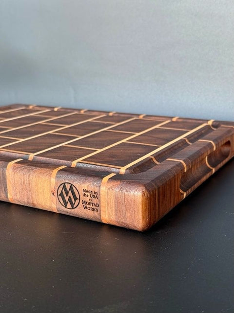Side view of brick pattern cutting board showing juice groove handcrafted in San Diego
