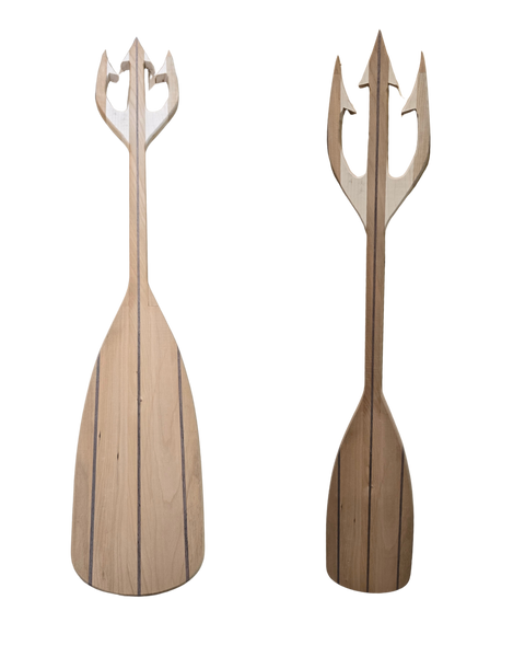 Two handcrafted wooden paddles with trident heads made by Mostad Works 