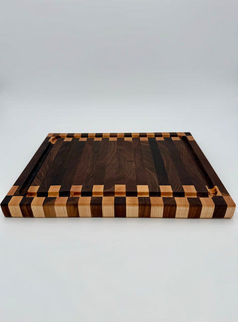 Angled view of zipper pattern end-grain cutting board handmade in San Diego