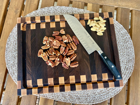 Zipper pattern cutting board in use with knife handmade in San Diego by Mostad Works
